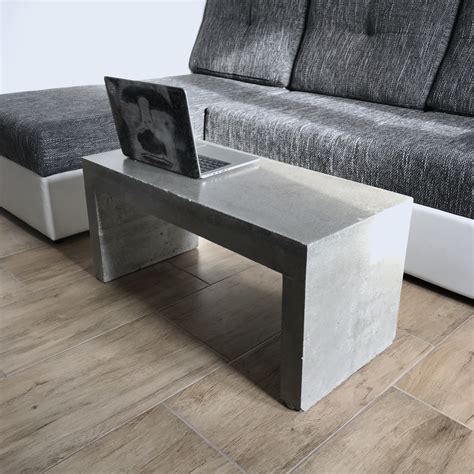 Concrete coffee table - While you can find coffee tables made of thick slabs of concrete block, it’s also possible to find tabletops from just a thin layer of concrete, which will take up much less visual …